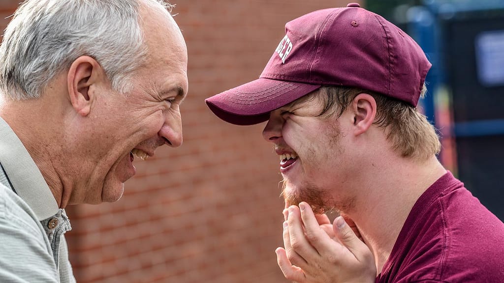 Man and boy laughing