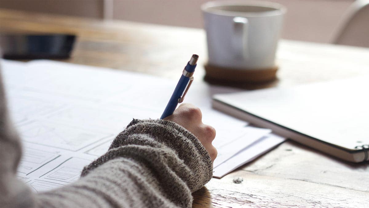 Person writing in diary