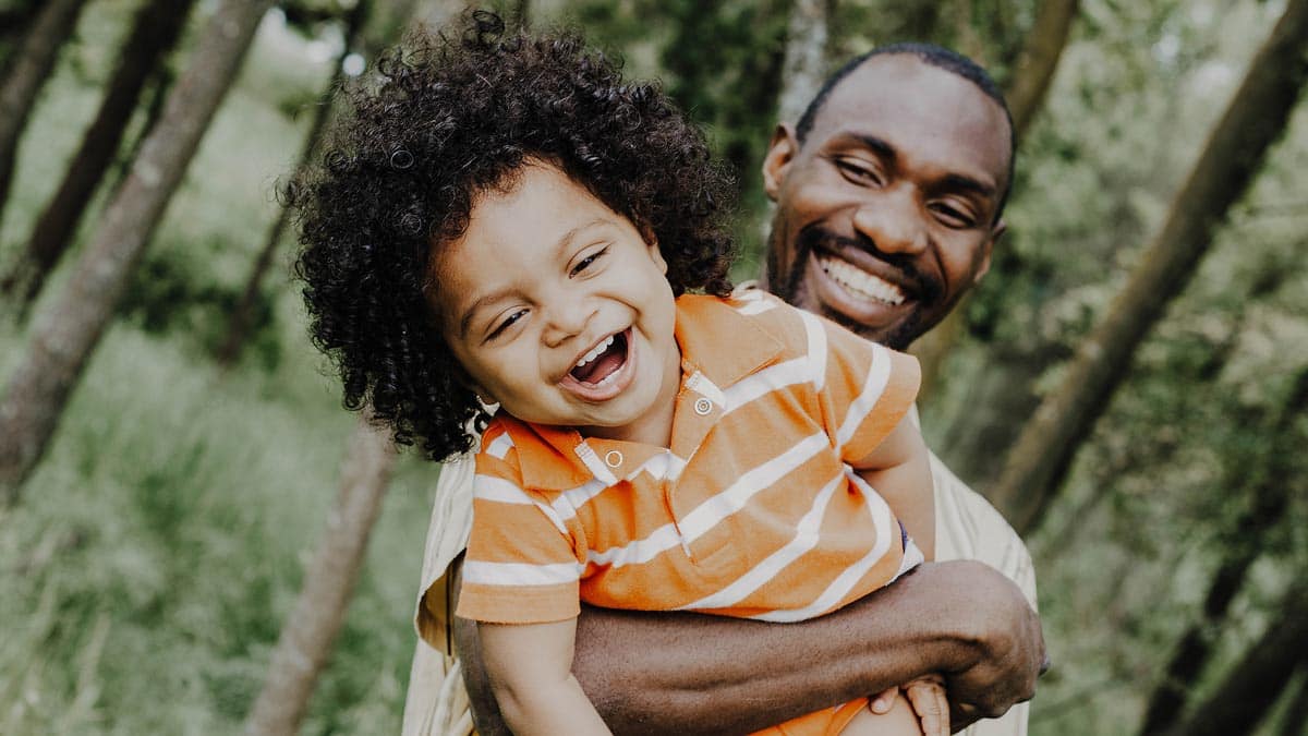 Smiling father and son