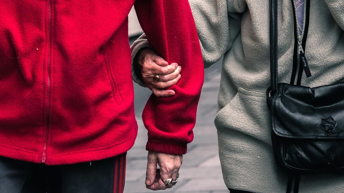 Woman holding on to a man's arm