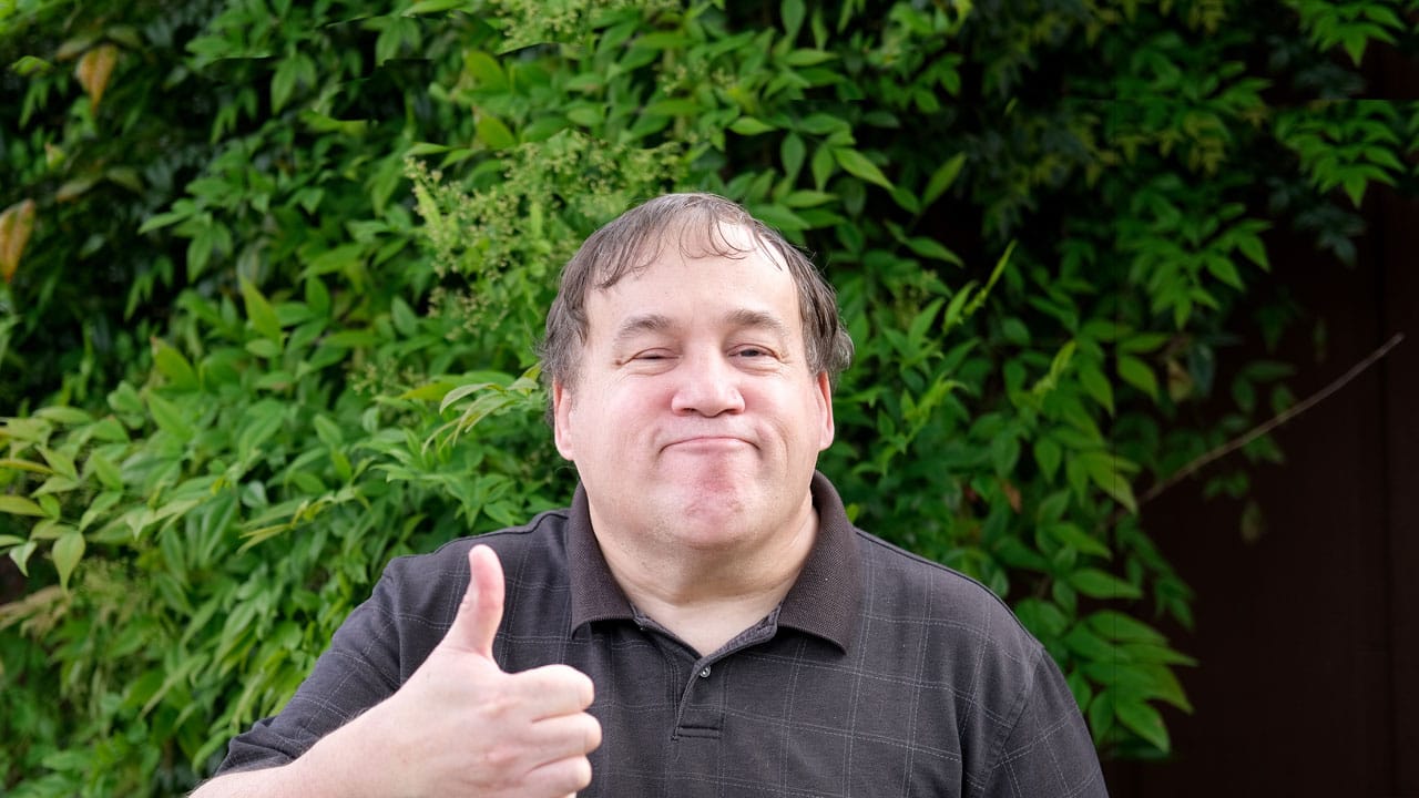 Adult man giving the thumbs up sign