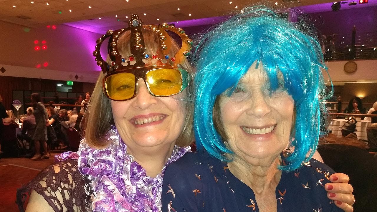 Smiling elderley mother with daughter